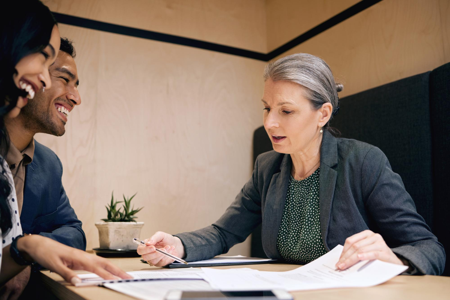 A translator goes through a translated legal document with a client to confirm accuracy