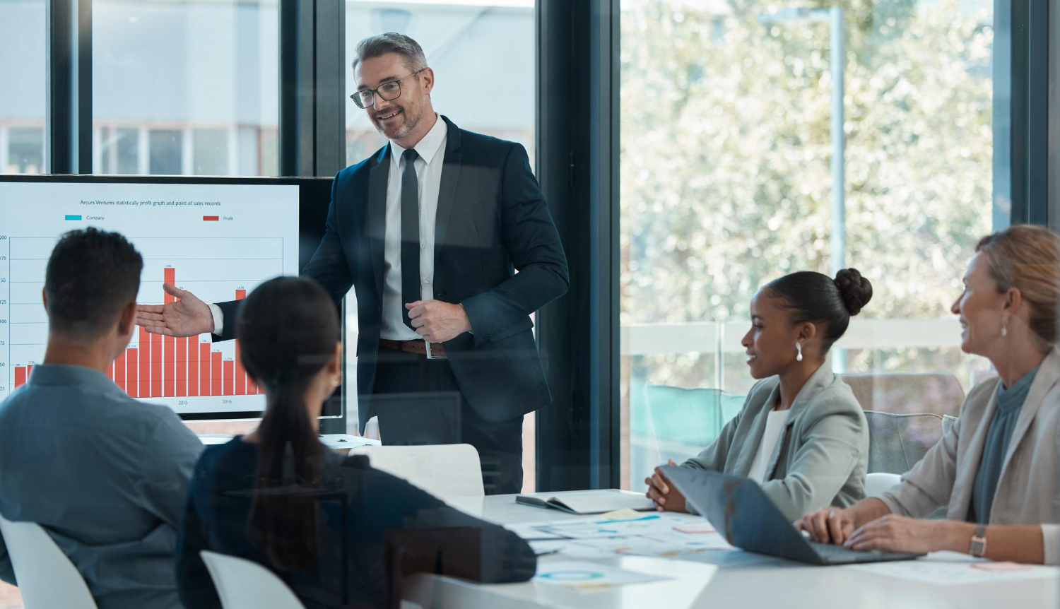 A finance manager presents to a group of shareholders