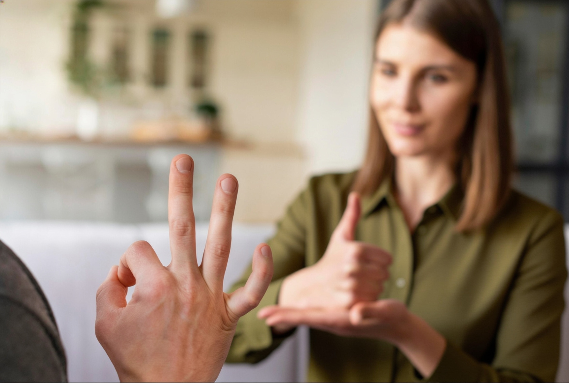 A conversation through sign language between 2 people